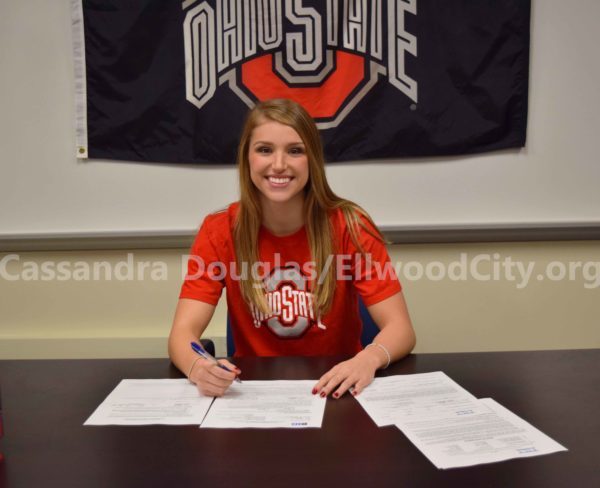 Taylor signing her letter of intent.